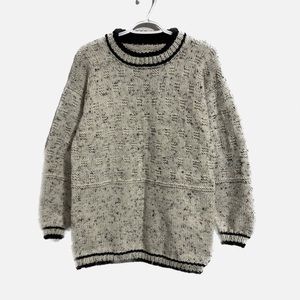 Hand knitted textured crew neck sweater. Save 25% when you buy two or more items